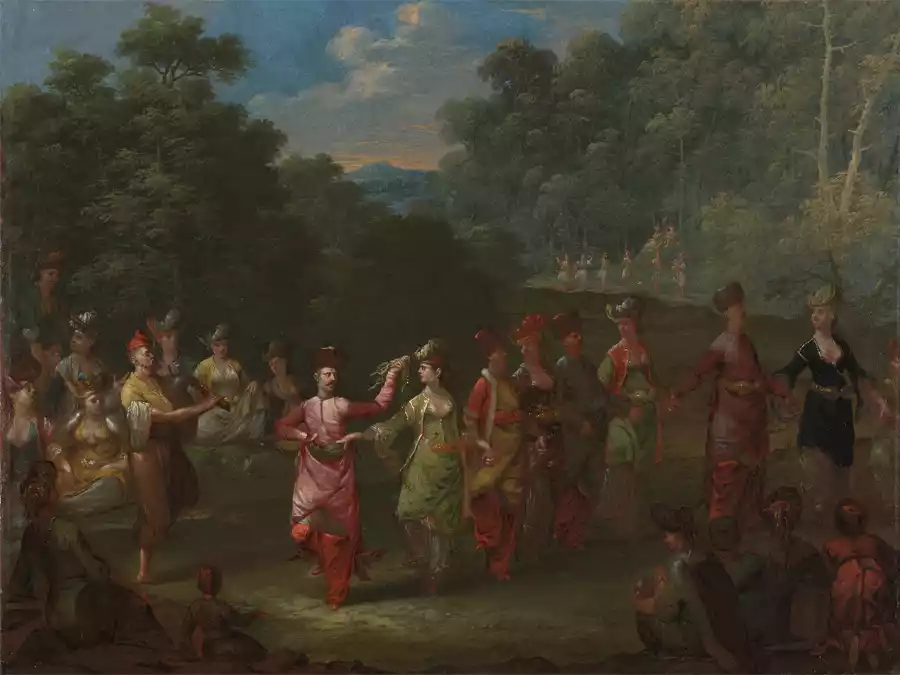 Uomini e donne greci danzano il Khorra in un vivace raduno.