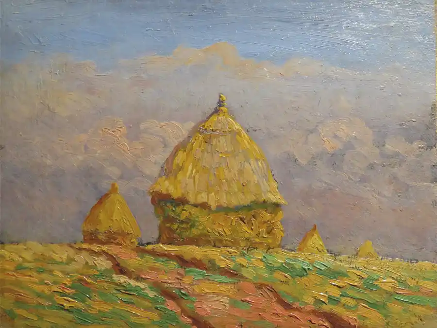 Paesaggio rurale con covoni e tetti di paglia.