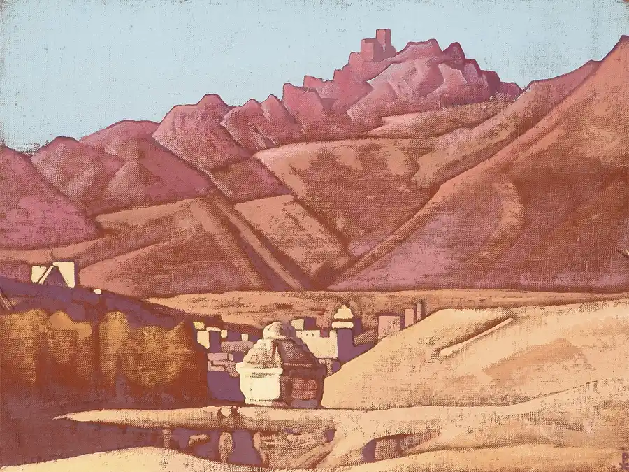 Landschap van Ladakh met golvende bergen en een pittoresk dorpje.
